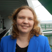 April Ferguson, Co-Owner and Operations Manager of Bright Haven Electric, smiling in a professional headshot.